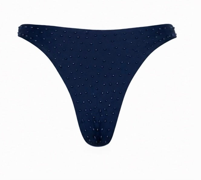 A dark navy blue thong-style bikini bottom covered in small, evenly spaced rhinestones, shown against a plain white background.