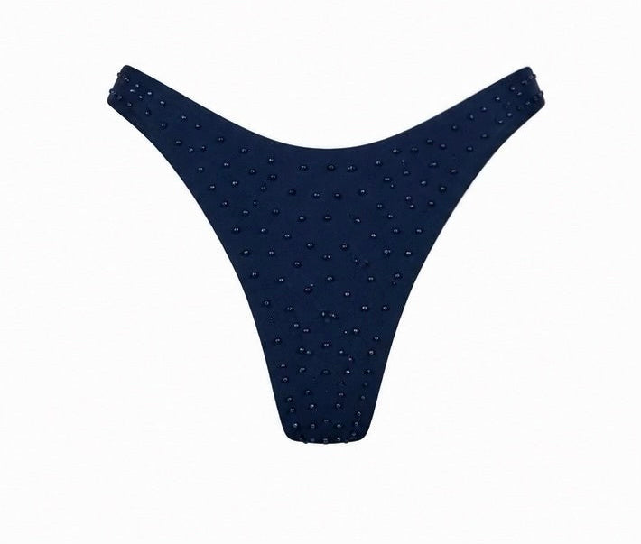 A two-piece bikini set in dark navy blue, featuring textured, dotted fabric with thin shoulder straps, shown against a plain white background.
