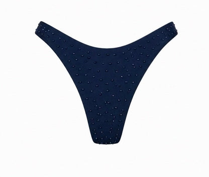 A two-piece bikini set in dark navy blue, featuring textured, dotted fabric with thin shoulder straps, shown against a plain white background.